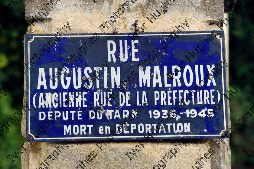 D3N3055 
 Albi town city centre Tarn France street sign old enamel rue Augustin Malroux politician local MP killed on deportation by Germans WWII 
 Keywords: Albi town city centre Tarn France street sign old enamel rue Augustin Malroux politician local MP killed on deportation by Germans WWII