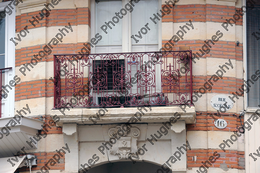 D3N3063 
 Albi town city centre Tarn France enamel street wrought iron veranda 
 Keywords: Albi town city centre Tarn France enamel street wrought iron veranda