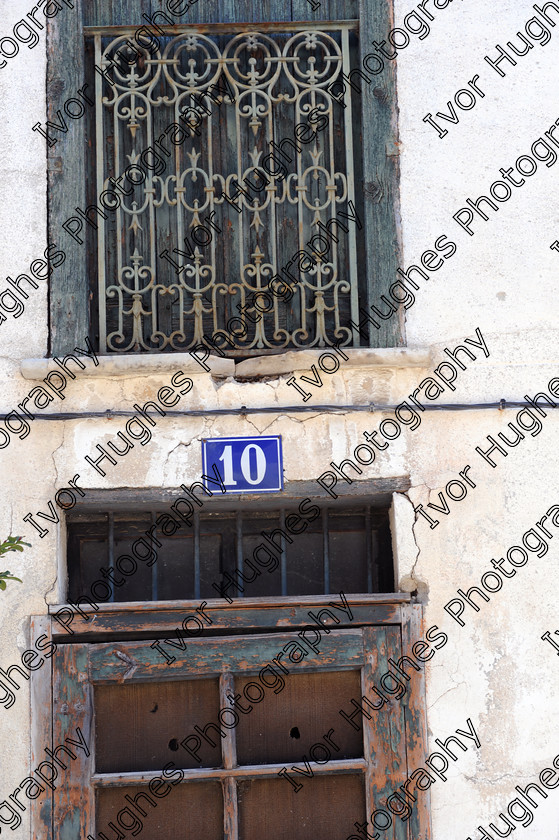 D3N 7644 
 Keywords: Elne Illiberis town village images Languedoc Roussillon 66 France Pyrenees ancient capital city French building street road traffic direction shop signs attention house number 10 ten