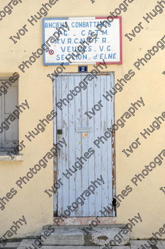 D3N 7638 
 Keywords: Elne Illiberis town village images Languedoc Roussillon 66 France Pyrenees ancient capital city French building street road traffic direction shop signs attention old soldiers anciens combattants widows club