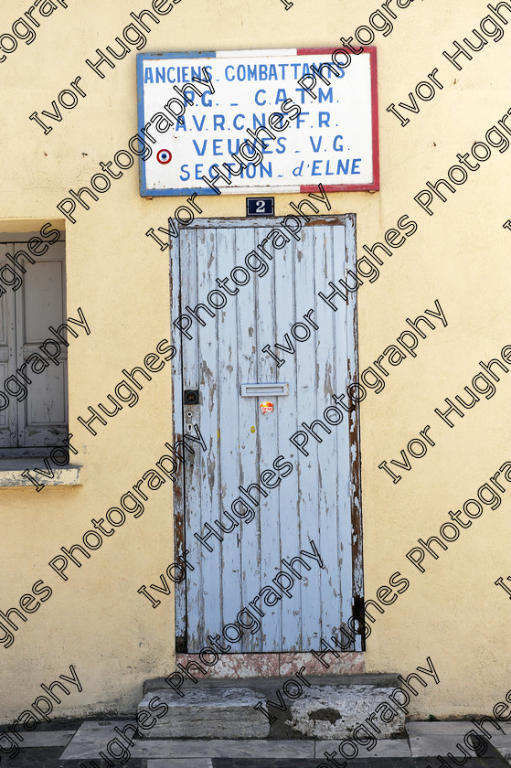 D3N 7639 
 Keywords: Elne Illiberis town village images Languedoc Roussillon 66 France Pyrenees ancient capital city French building street road traffic direction shop signs attention old soldiers anciens combattants widows club