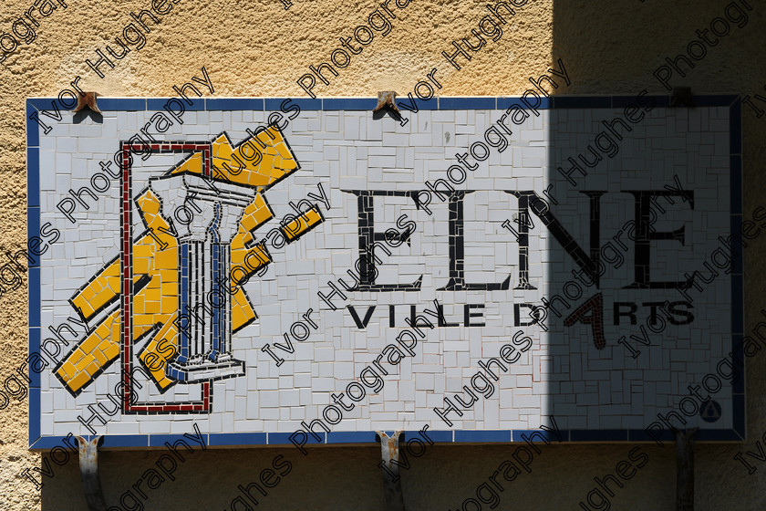 D3N 7694 
 Keywords: Elne Illiberis town village images Languedoc Roussillon 66 France Pyrenees ancient capital city French building street road traffic direction shop signs attention ville d'art emblem