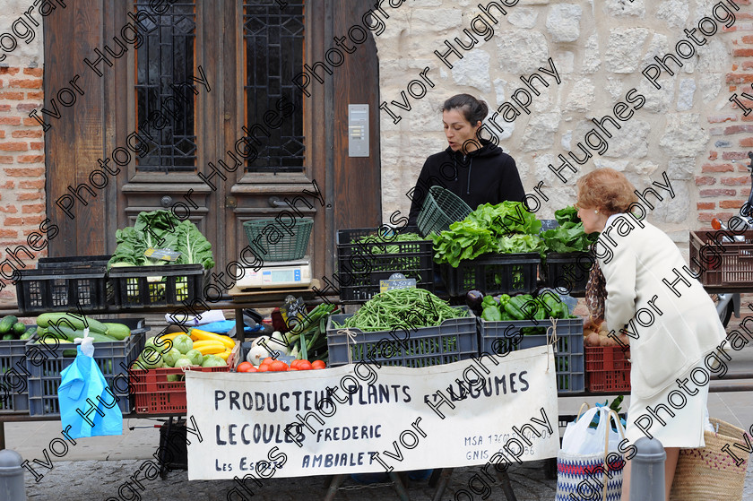 02 
 French rural farmers food market stand trader fruit vegetables serving customer 
 Keywords: French rural farmers food market stand trader fruit vegetables serving customer